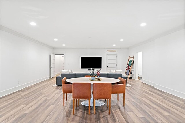 exercise room featuring recessed lighting, baseboards, and ornamental molding