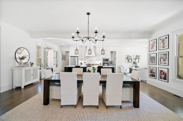 dining area featuring baseboards, crown molding, dark wood-type flooring, and visible vents