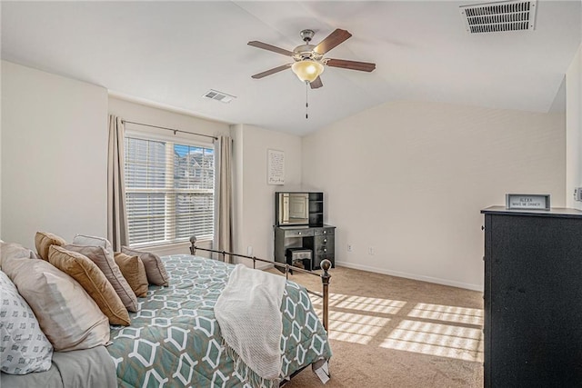 bedroom with lofted ceiling, carpet, visible vents, and baseboards