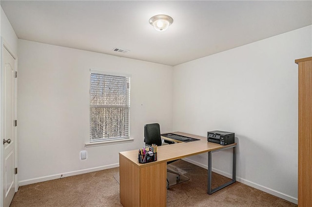 office with baseboards, visible vents, and carpet flooring