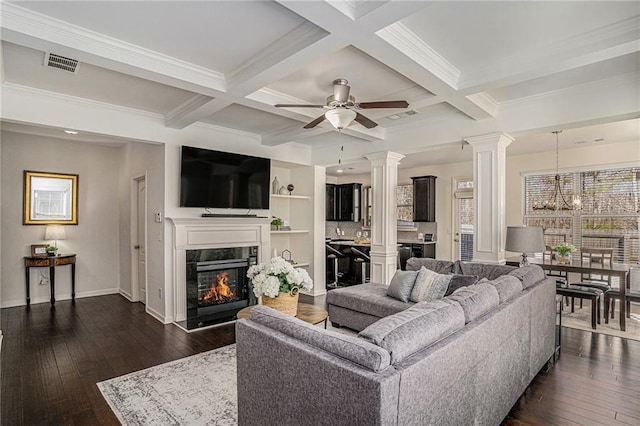 living area featuring visible vents, coffered ceiling, dark wood-type flooring, and a high end fireplace