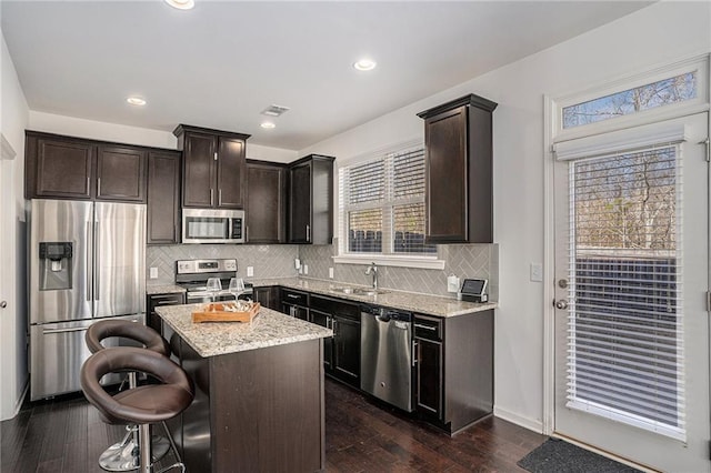 kitchen with plenty of natural light, visible vents, stainless steel appliances, and a sink