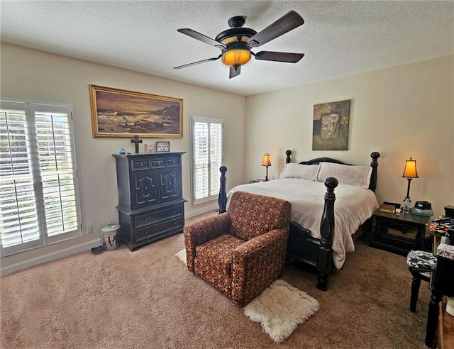 bedroom with multiple windows, a textured ceiling, and ceiling fan