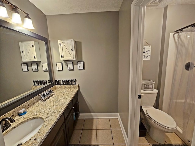 bathroom with tile patterned floors, toilet, a shower with curtain, a textured ceiling, and vanity