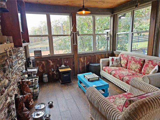 sunroom featuring wood ceiling