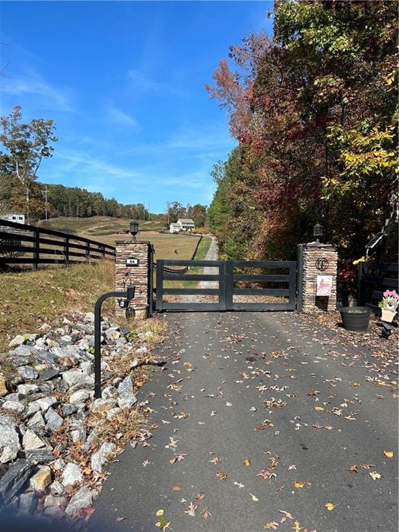 view of gate featuring a rural view