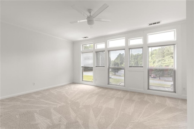 90 Grove Park Ln, Woodstock, GA 30189 - spare room featuring light carpet, baseboards, a ceiling fan, and crown molding
