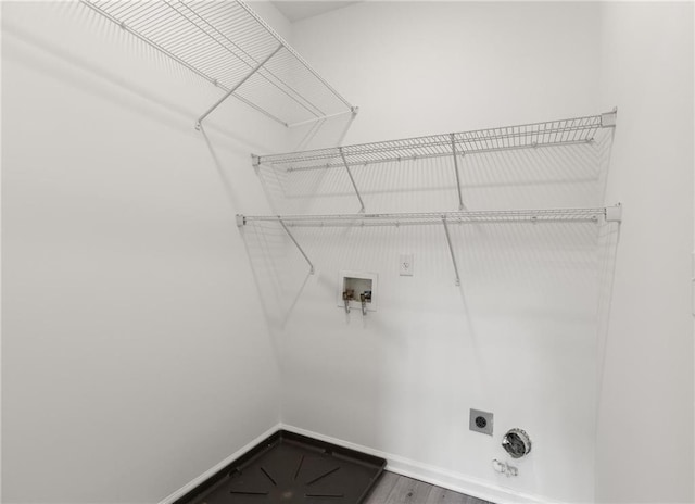 90 Grove Park Ln, Woodstock, GA 30189 - laundry area with hookup for an electric dryer, washer hookup, baseboards, and wood finished floors