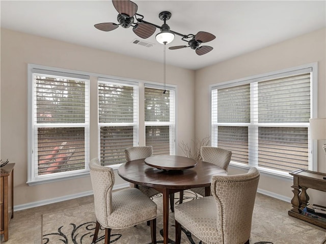 dining room with visible vents and baseboards