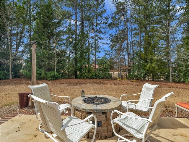 view of patio with a fire pit