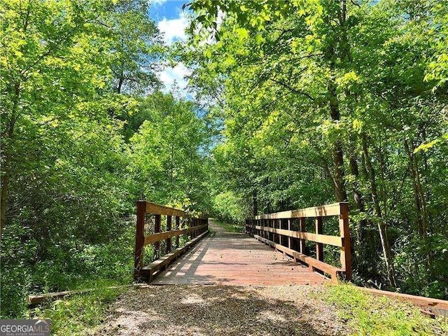 view of community featuring a forest view