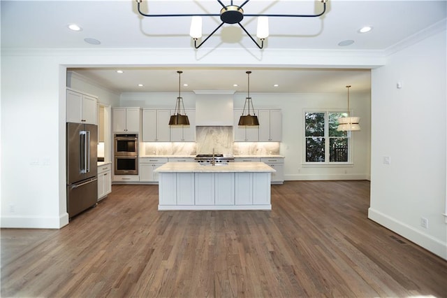 kitchen featuring white cabinetry, stainless steel appliances, and backsplash