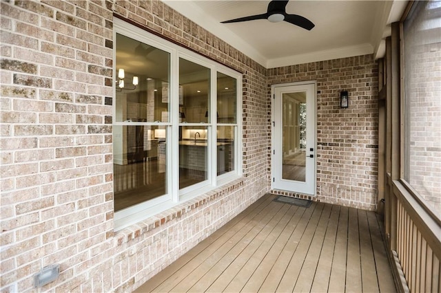 wooden deck with ceiling fan