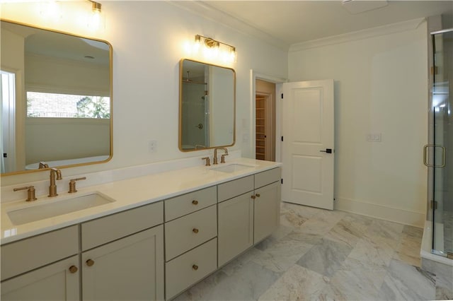 bathroom featuring crown molding, vanity, and a shower with shower door