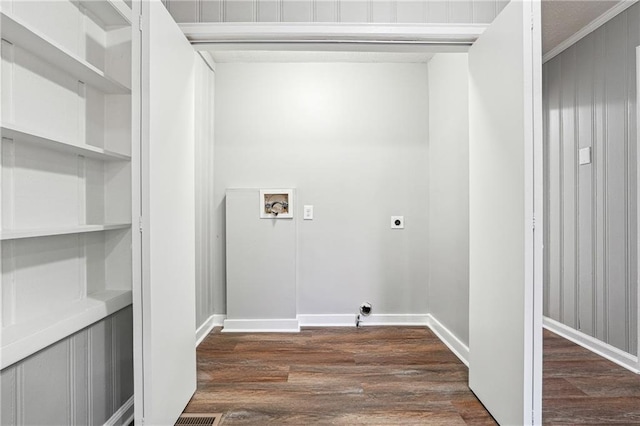 clothes washing area with washer hookup, dark wood-type flooring, hookup for an electric dryer, and crown molding