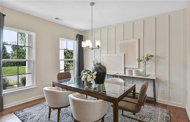4297 Azalea Ridge Way, Hoschton, GA 30548 - dining space with plenty of natural light, a chandelier, wood finished floors, and baseboards