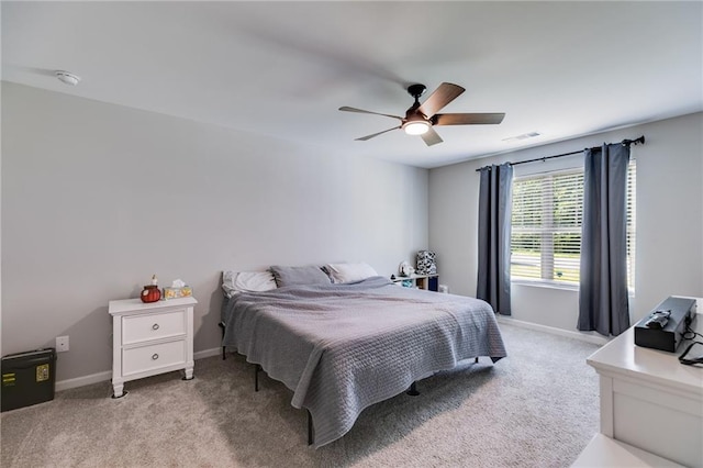 119 Sourwood Ln, Temple, GA 30179 - bedroom with visible vents, baseboards, ceiling fan, and light carpet