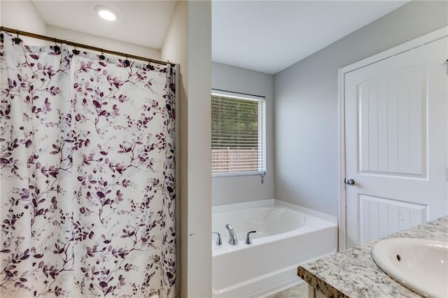 119 Sourwood Ln, Temple, GA 30179 - bathroom with a garden tub, a shower with shower curtain, and vanity