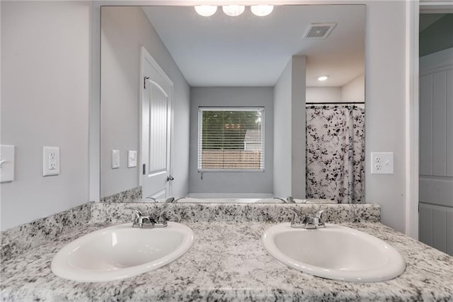 119 Sourwood Ln, Temple, GA 30179 - bathroom with double vanity, visible vents, and a sink