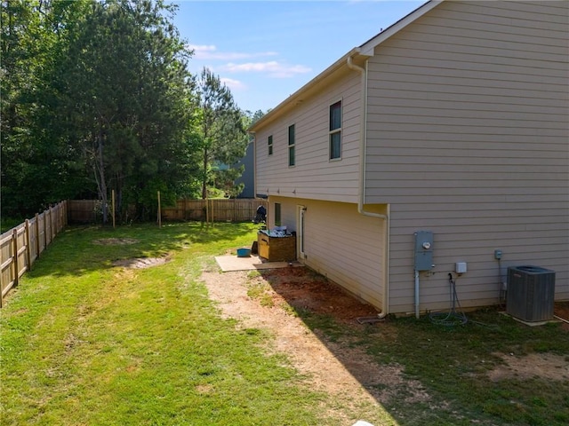 119 Sourwood Ln, Temple, GA 30179 - view of side of property featuring a fenced backyard, a yard, and central AC unit