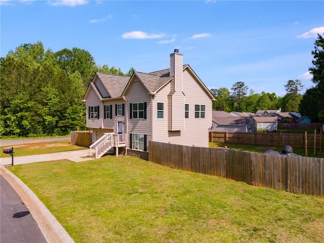 119 Sourwood Ln, Temple, GA 30179 - back of property with fence, a yard, and a chimney