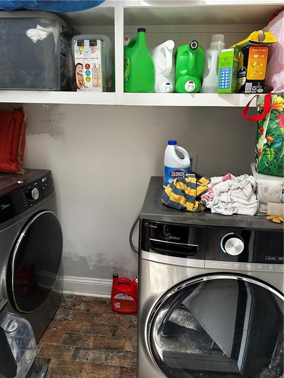 laundry area featuring washing machine and clothes dryer