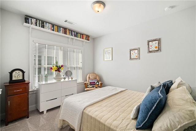 bedroom with carpet floors and visible vents