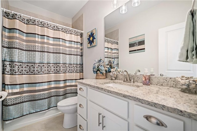 bathroom featuring tile patterned flooring, shower / bathtub combination with curtain, vanity, and toilet