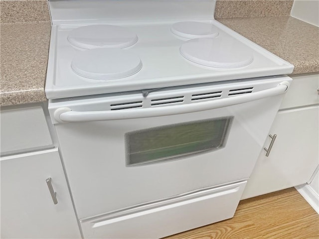 475 Mount Vernon Hwy NE Unit C230, Sandy Springs, GA 30328 - kitchen view of white electric range and white cabinetry