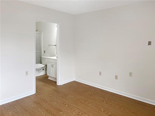 475 Mount Vernon Hwy NE Unit C230, Sandy Springs, GA 30328 - unfurnished bedroom with wood finished floors and ensuite bath
