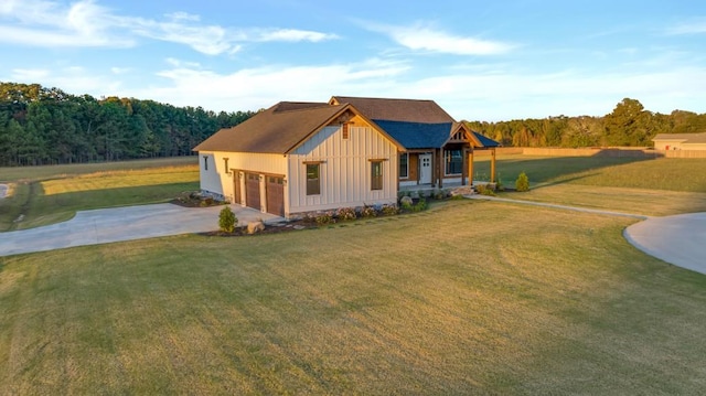 view of front of property featuring a garage and a front lawn