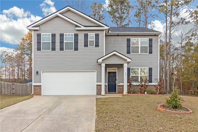 view of front of house featuring a front lawn and a garage