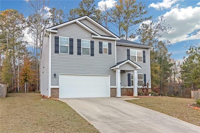 view of front of house featuring a front yard and a garage