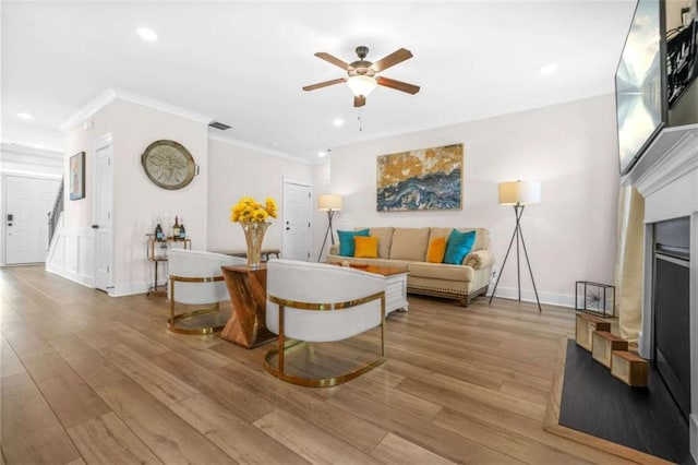 living room with a ceiling fan, wood finished floors, and recessed lighting