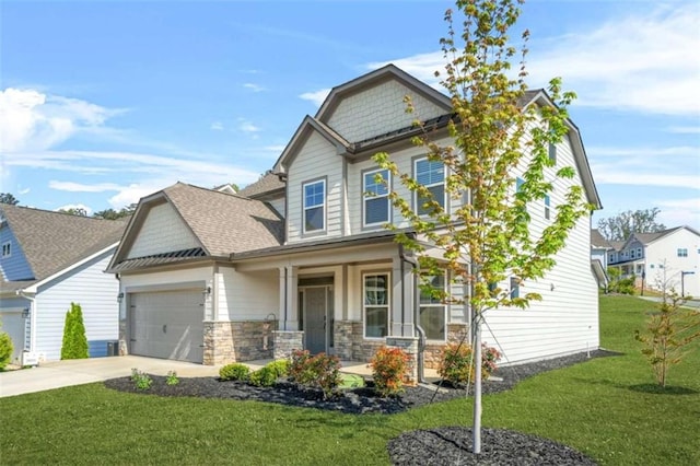 craftsman house featuring concrete driveway, stone siding, an attached garage, a porch, and a front yard