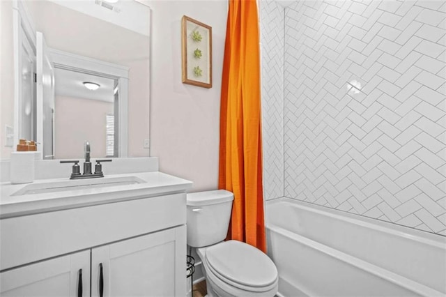 bathroom with visible vents, vanity, shower / bathtub combination with curtain, and toilet