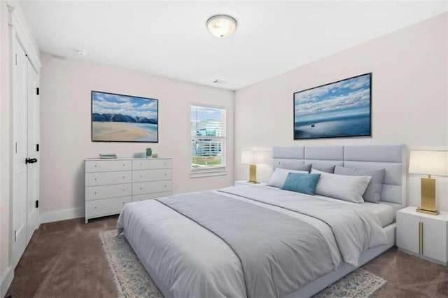 carpeted bedroom with baseboards