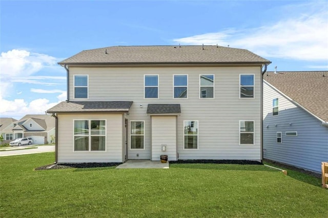 back of house featuring a yard