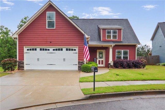 view of front of home featuring concrete driveway and stone siding