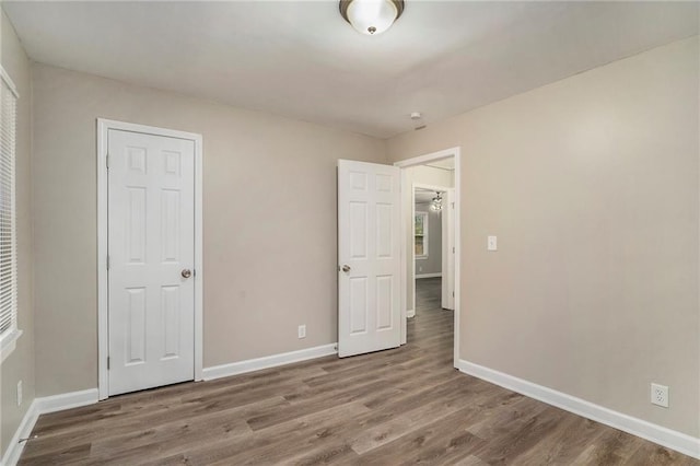 unfurnished bedroom featuring hardwood / wood-style floors