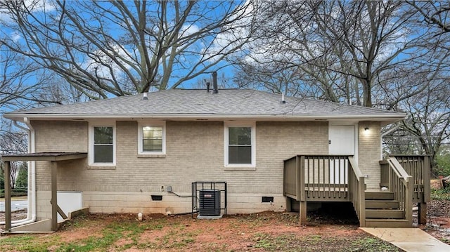 rear view of house with a deck and central air condition unit