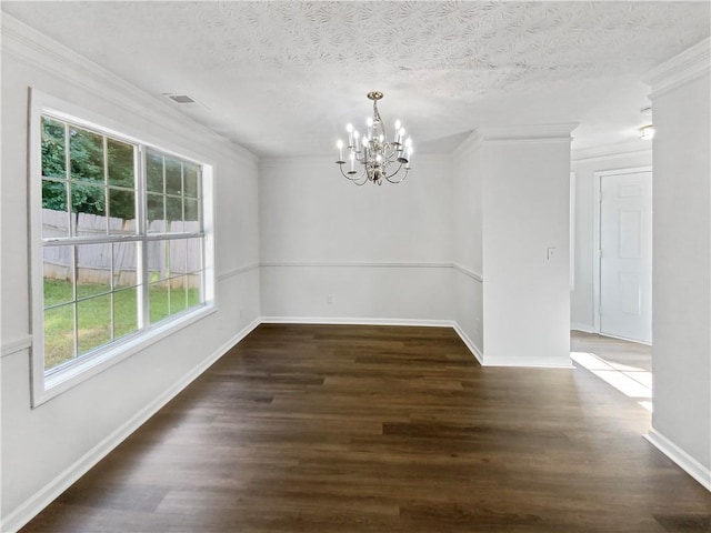 unfurnished dining area with a chandelier, dark wood-type flooring, a textured ceiling, and ornamental molding