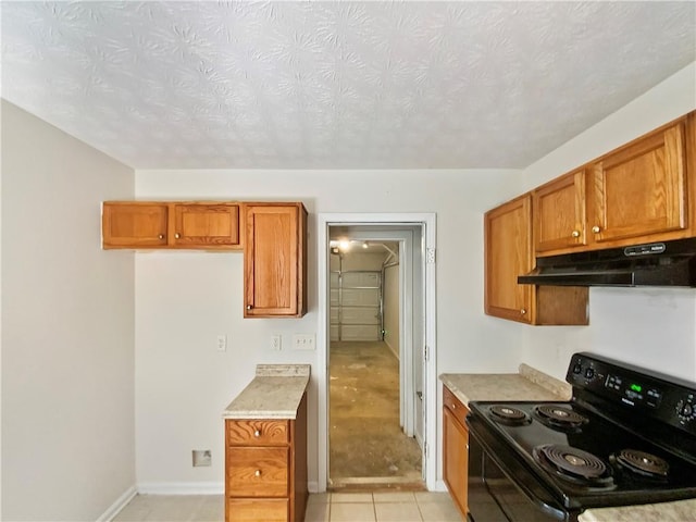 kitchen featuring a textured ceiling and black electric range oven