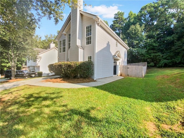 view of property exterior featuring a yard