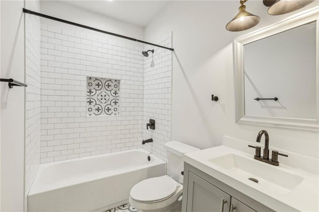 full bathroom with vanity, toilet, and tiled shower / bath combo