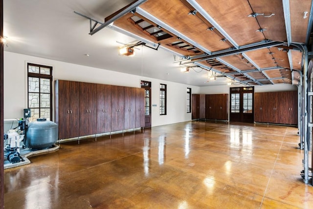 garage with french doors and a garage door opener