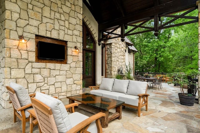 view of patio featuring outdoor dining area and an outdoor living space