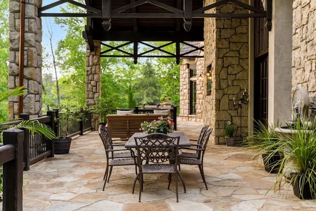 view of patio with a gazebo and outdoor dining space