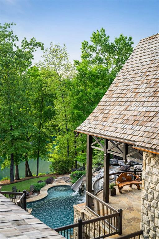 pool featuring a patio and a water slide