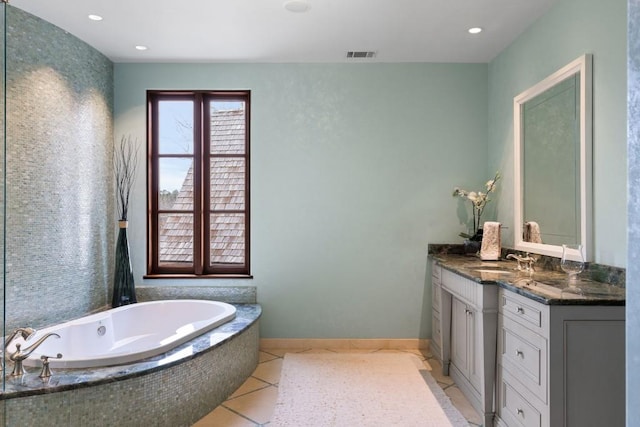 bathroom featuring tile patterned flooring, vanity, recessed lighting, visible vents, and a garden tub